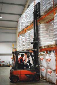 Crisp Malt warehouse | Malt bags on warehouse racking with forklift truck