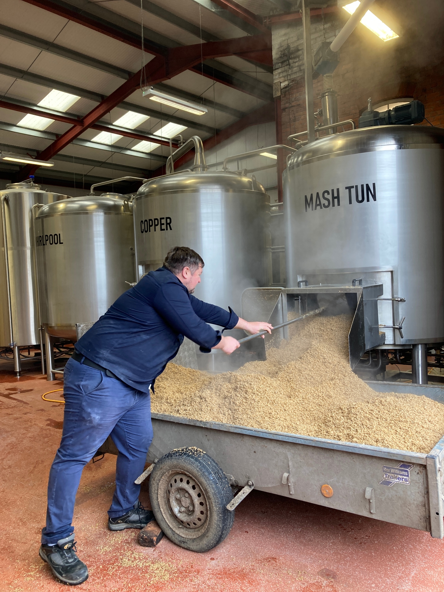 Emptying the mash tun at the Redwillow Brewery during the Crisp Malt beer collab.