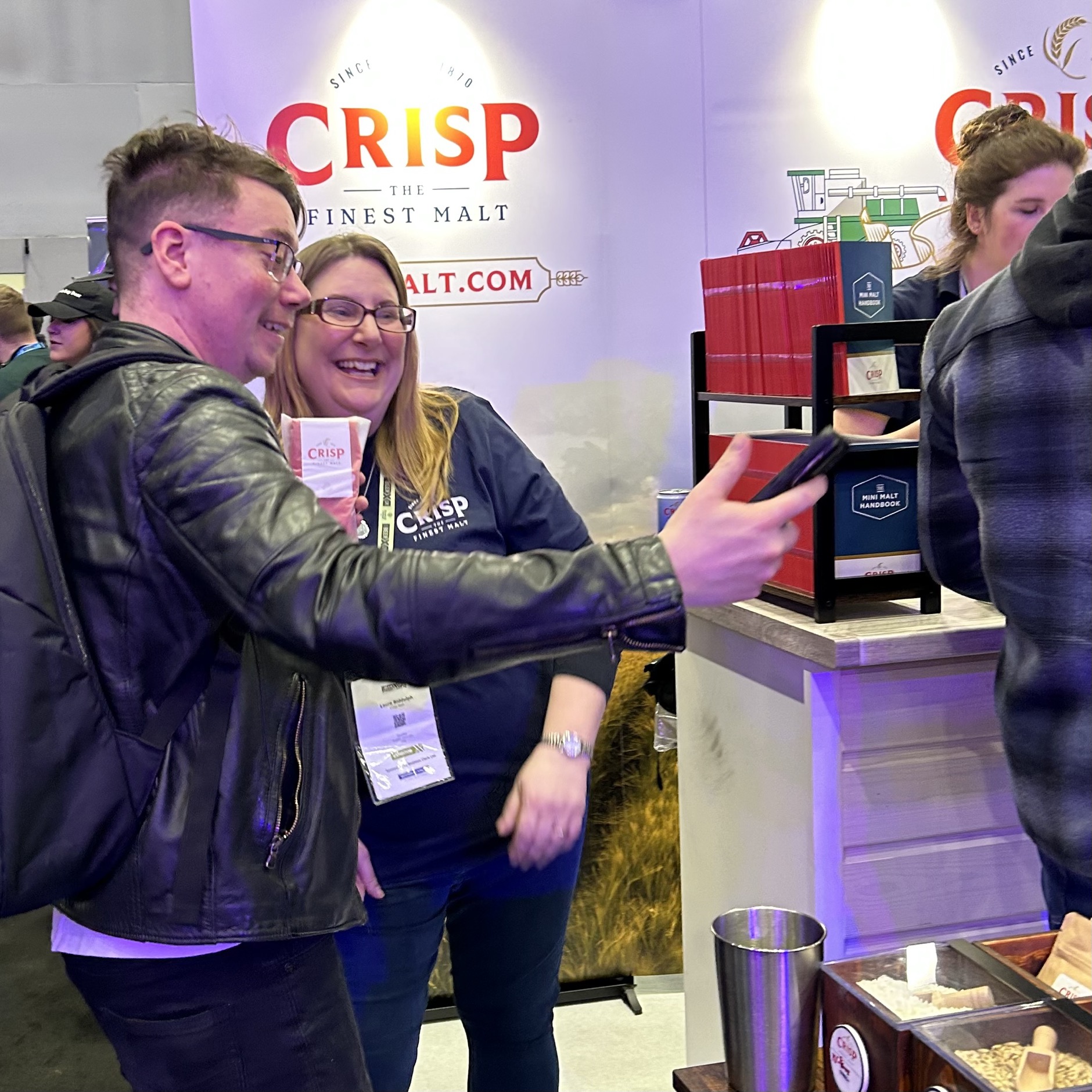 Laura Biddulph our Craft Sales Operations Administrator at Crisp Malt helps a customer on the BeerX stand